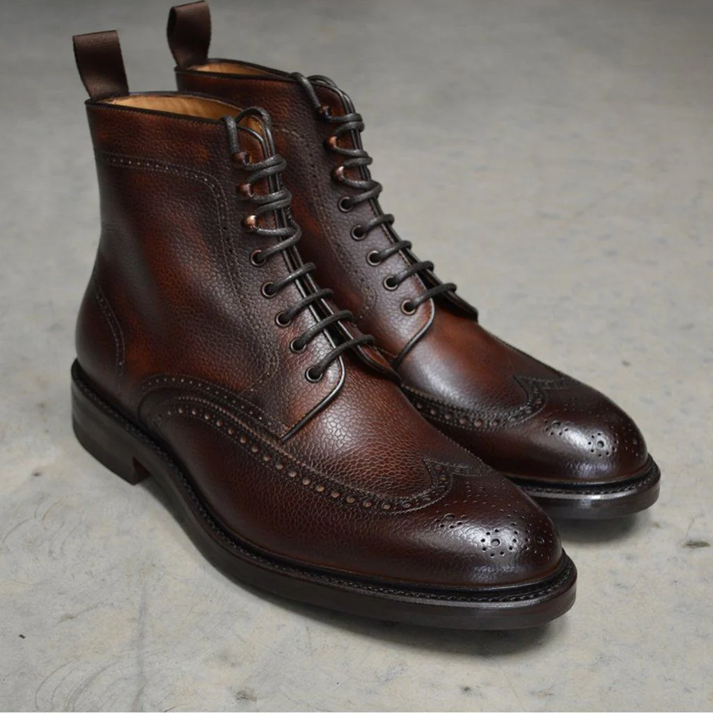 Classic brown and black classic brogue pattern leather boots